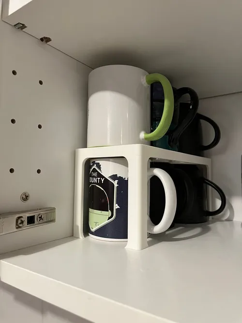 Cabinet shelf organizer creating extra storage levels