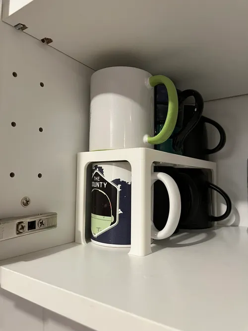 Cabinet shelf organizer creating extra storage levels