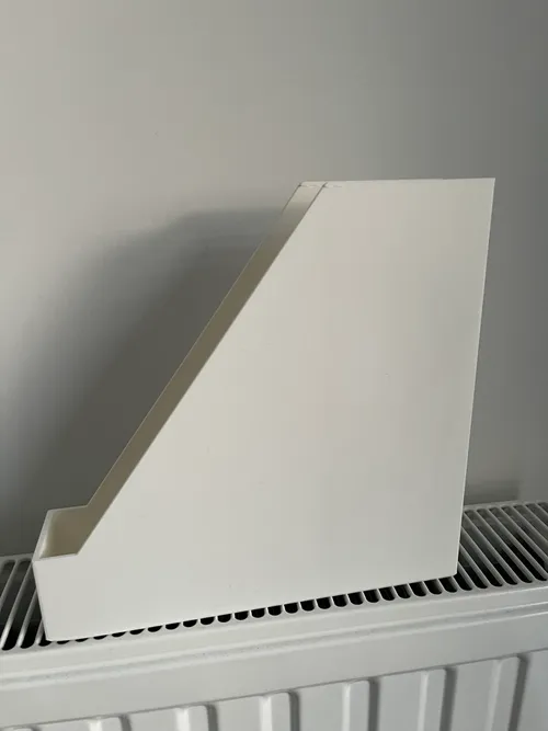 Magazine file holder on a shelf